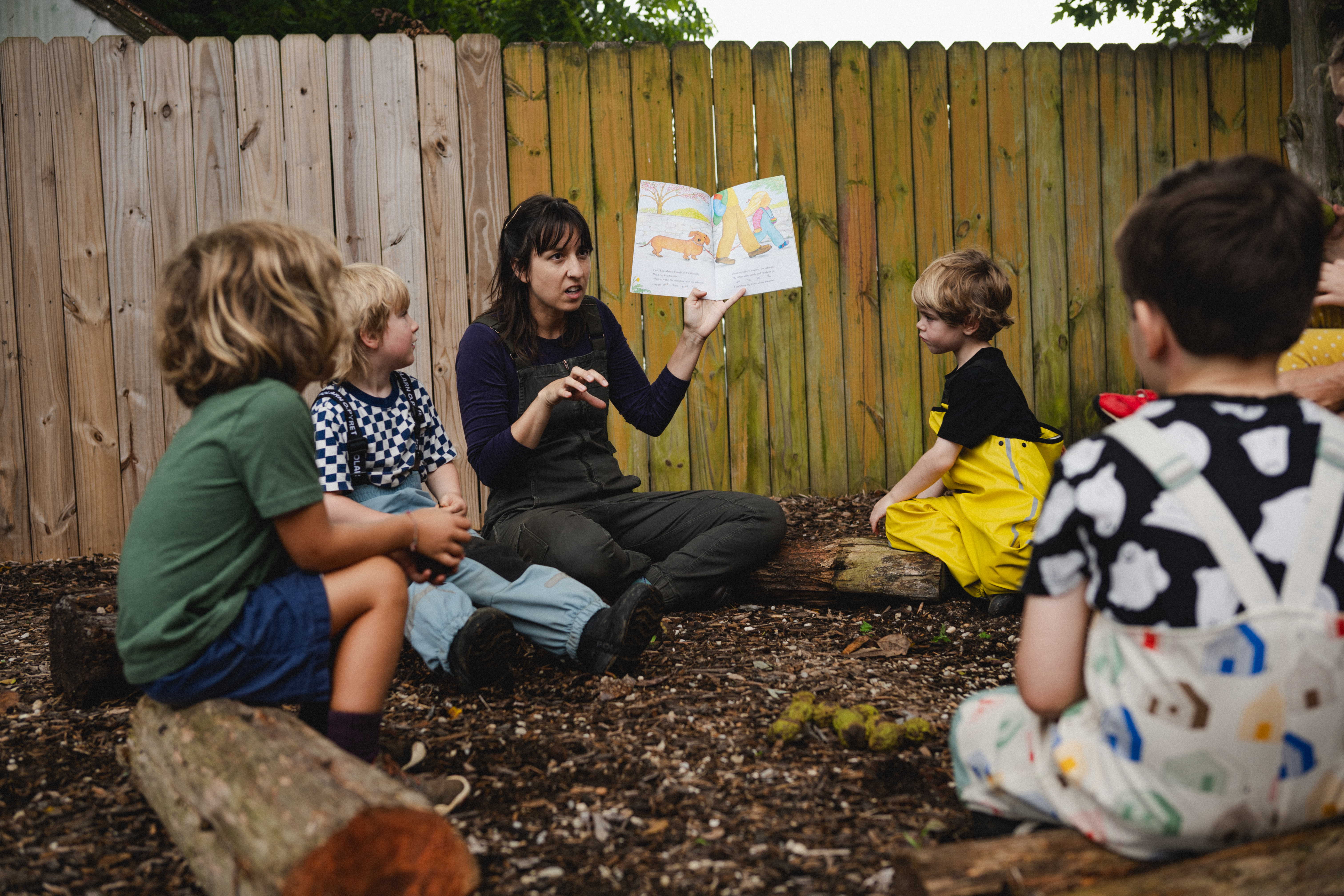 small preschool group listening to book